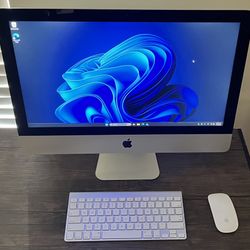 Apple 21.5” iMac. 2.7 GHZ Quad Core i7. 1 TB SSD. 16 GB Ram Windows 11 Pro