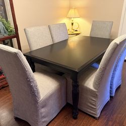 Black Rectangle Dining Table with 6 Covered Grey Upholstered Chairs
