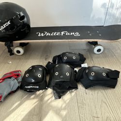 White fang skateboard with schwinn gloves, knee pads and Razor helmet