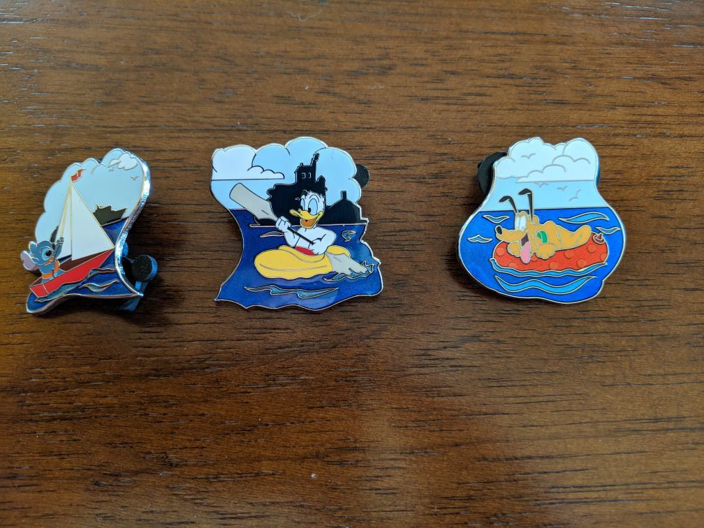 3 different Disney Cruise line pins featuring Pluto, Donald Duck and Stitch