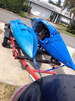 Two (2) Kayaks with electric motors  and trailer