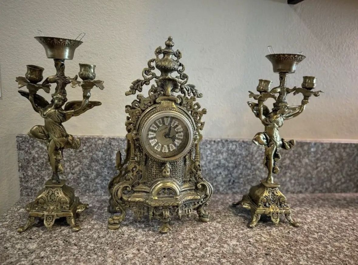 “Antique Clock and Decorative Candlesticks with Classic Design”