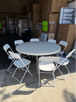 60-inch round table with 8 chairs—all brand new.