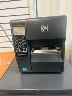 Zebra ZT230 Industrial Label Printer with full box of labels