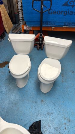2 matching ADA height Kohler toilets.  Excellent condition