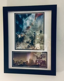 Framed Historic photos. September 11th themed matted, framed photos. One of photos has “heroes” first day edition stamp. Frame is 14 x 18.