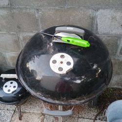 A Couple Barbecue Grills And Also Some Vintage Superman And Batman Posters