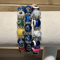 3 evil eye stretch bracelets.
