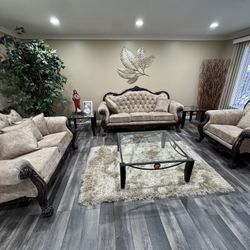 sofa set featuring intricate dark wood accents for a living room comes with a full set table.