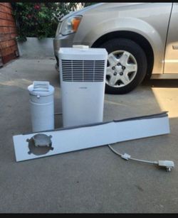 Like new portable ac with hose/remote and window kit/ blows ice cold air fast/ can test before buying