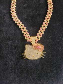 Hello Kitty pendant with pink/gold iced cuban chain