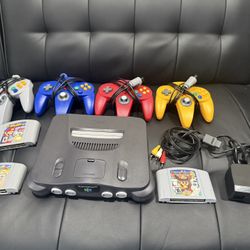 Nintendo 64 W/ 4 Controllers And Games ( Mario Kart 64, Super Smash Bros., Mario Party 2) 