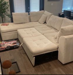 Large Crème Sectional sofa — let out