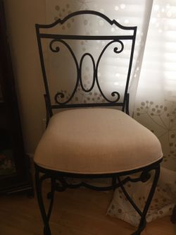 One accent chair , can be used with a bar round table on the side .