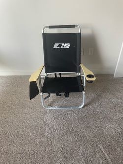 Fold up chair with shoulder straps