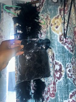 Feather boa and heart glasses
