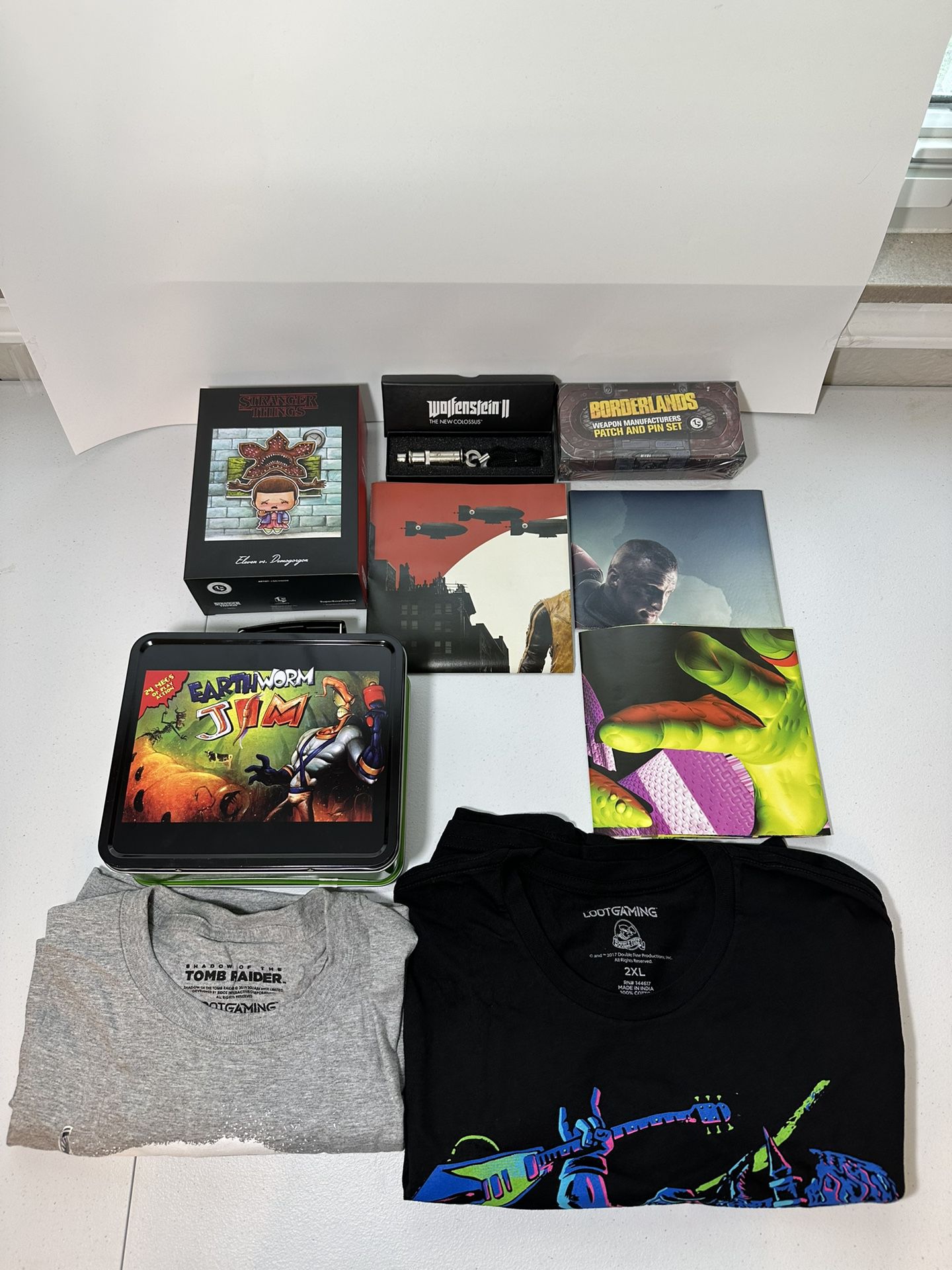 Lootcrate open box, tshirts, lunch box Jimmy, stranger things toy, posters