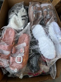 A box of various shoes