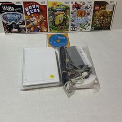 nintendo wii + 6 games  complete