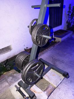 200 lbs standard size weights and bar. 1” inch. Diameter with stand.