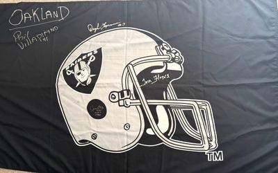 The Las Vegas Raiders Players On The Autographed Banner: