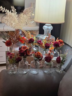 10 fall Lovely floral arrangements in clear vases.