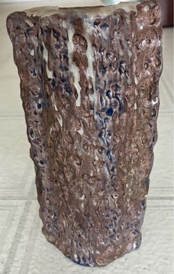 Handmade clay candle holder. 8 1/2” tallX4 1/2”wide.