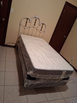 Twin bed with mattress and boxspring. Asking $150 or best offer.