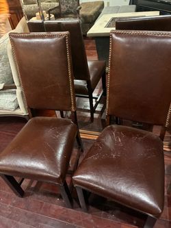 Two brown leathers seats