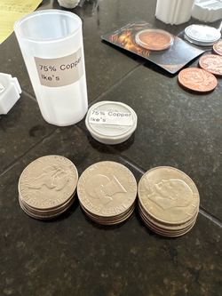 15 - Ike dollars & 10 - half dollars
