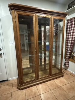 LARGE OAK AND BEVELED GLASS CHINA DISPLAY CABINET
