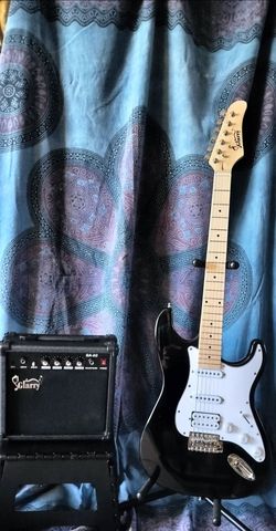 Brand new electric guitar with new 20 watts amp bag cable and shoulder strap