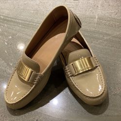 Calvin Klein Flats Patent Leather with a Gold plate displaying the Calvin Klein logo.