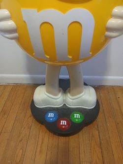 Giant Yellow M&M Display On Wheels