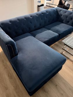Blue sectional and accent chair