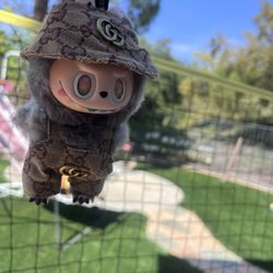 grey labubu with outfit 98