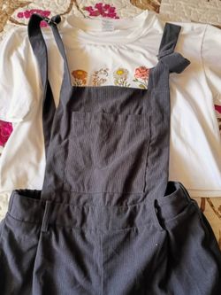 Black overalls and flower T-shirt