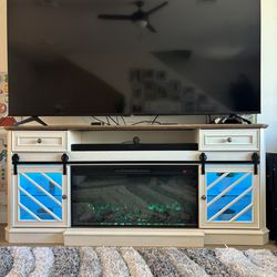 Entertainment stand with multi color fire place/light