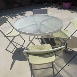 40” Diameter Round Glass Patio Table With Four Foldable Chairs!
