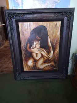 Girl comforting a little girl, with a hug