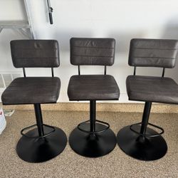3 Brown Leather Adjustable Bar Stools. Great Condition. $900 Value