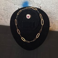 Gold tone, silver necklace, and ring ring has red stone