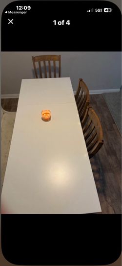 White Rectangular Dining Table with four brown table chairs