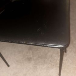 4 Small Black Chairs And A Black Small Table 