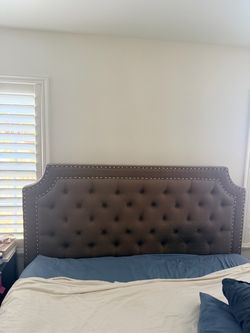 Grey upholstered button tuft cal-king headboard