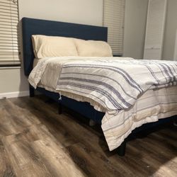 blue fabric and wood queen size bed frame