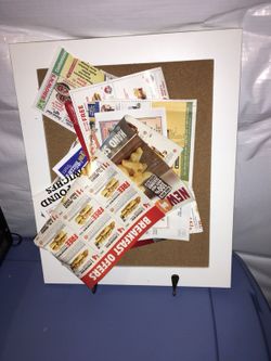 White framed bulletin board with hooks