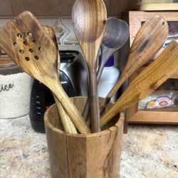 wooden canister with wooden utensils 