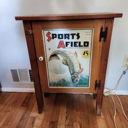 Fishing Style Wood Cabinet With Tin "Sports Afield" Graphic On Door