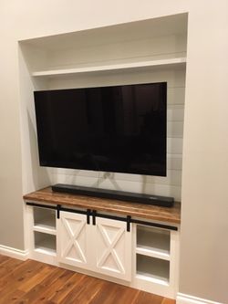 Barn door entertainment console TV stand